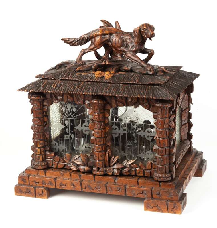 Fabulous antique walnut Black Forest Liquor Cabinet with fully carved hunting dog on top, circa: Fabulous antique walnut Black Forest Liquor Cabinet with fully carved hunting dog on top, circa 1890, in original finish, measures 17 1/2" L x 13" W x 18" T, with beautiful etched glass windows. When