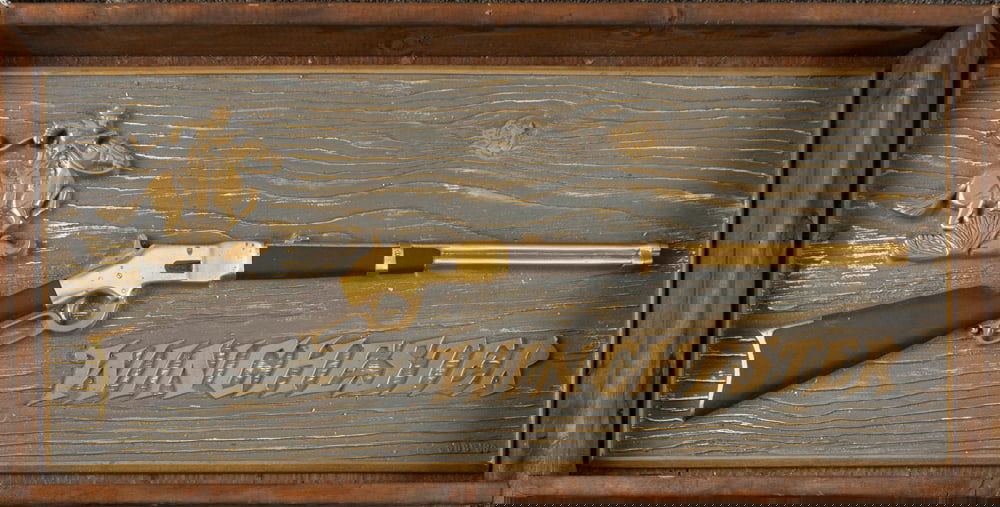 Scarce Winchester Bronze Advertising Plaque, SN 33. Large Bronze Plaque measures 34" L x 14 1/2" T,: Scarce Winchester Bronze Advertising Plaque, SN 33. Large Bronze Plaque measures 34" L x 14 1/2" T, is solid bronze with Winchester Rider, an 1866 Carbine and the stylized "WINCHESTER" trademark name.