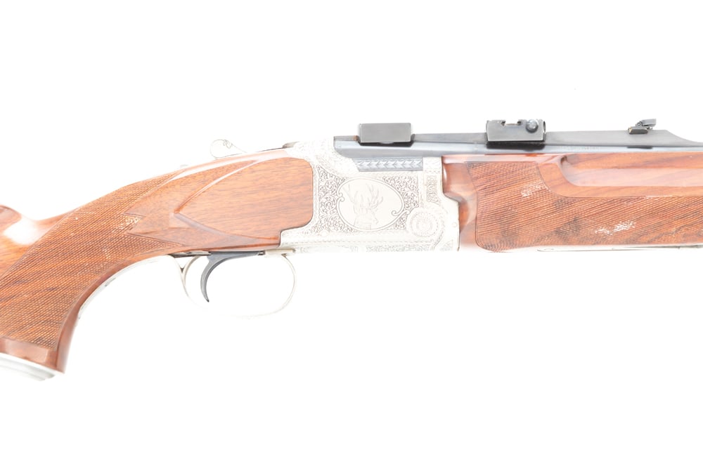 Winchester, Grand European Model, .30/06 caliber, O/U Rifle, SN DRN00454. Very rare Rifle with 23: Winchester, Grand European Model, .30/06 caliber, O/U Rifle, SN DRN00454. Very rare Rifle with 23 1/2" barrels, folding leaf sight and claw style scope bases. Coin nickel receiver with scroll engravin