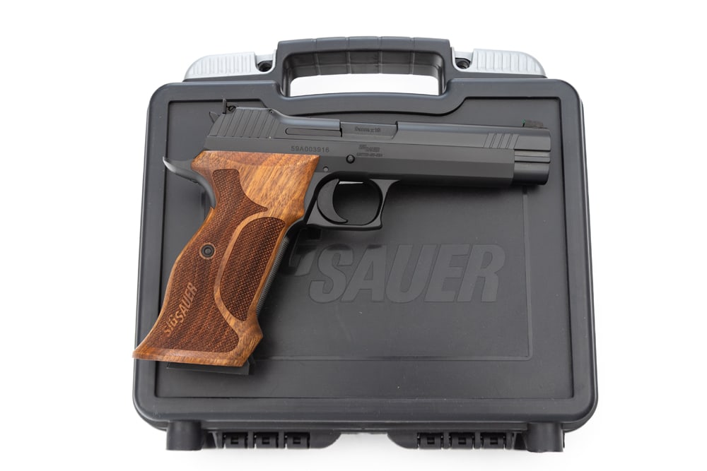 Sig Sauer, Model P210, Semi-Auto Pistol, 9MMX19 caliber, SN 59A003916, matte finish, 4 1/2" barrel,: Sig Sauer, Model P210, Semi-Auto Pistol, 9MMX19 caliber, SN 59A003916, matte finish, 4 1/2" barrel, near pristine condition, with original "Sig Sauer" marked wooden grips. Sold in original serial numb