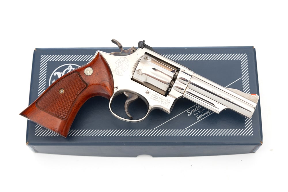 Smith & Wesson, Model 19-3, DA Revolver, .357 Mag. caliber, SN 4K98400, nickel finish, 4" barrel,: Smith & Wesson, Model 19-3, DA Revolver, .357 Mag. caliber, SN 4K98400, nickel finish, 4" barrel, fine condition with light turn line. Sold in original serial numbered blue box with S&W paper wrap. (M