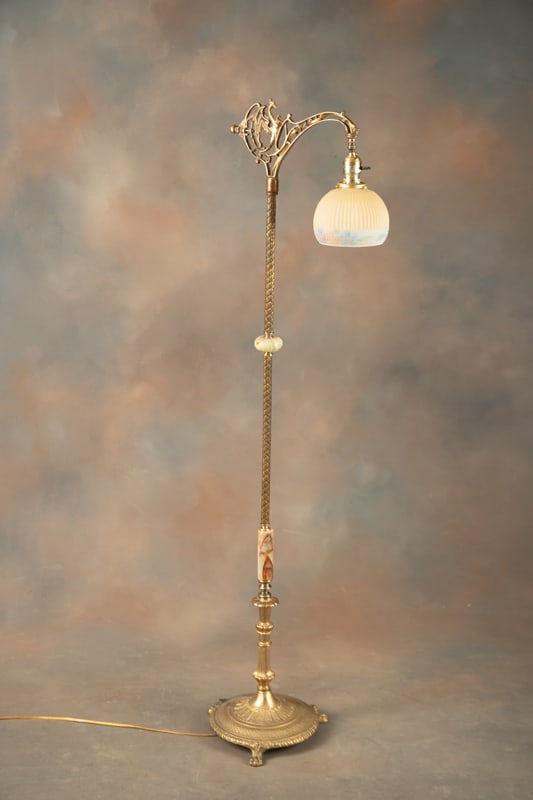Antique, fully restored Goose Neck Bridge Lamp with round brass claw foot base. Embossed brass stem: Antique, fully restored Goose Neck Bridge Lamp with round brass claw foot base. Embossed brass stem with onyx spacers, original 6" Dia. reeded and multi-color shade, measures 58" T with heavy weighted