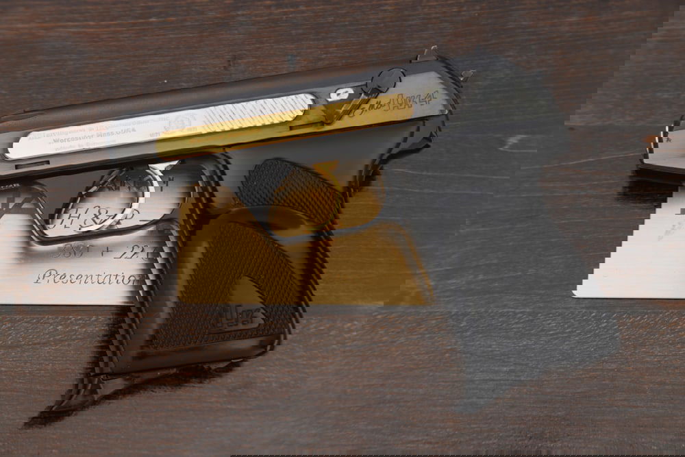 Presentation Style Harrington & Richardson, Model HK4, Semi-Auto Pistol, 9 MM/.22 L.R. caliber, SN: Presentation Style Harrington & Richardson, Model HK4, Semi-Auto Pistol, 9 MM/.22 L.R. caliber, SN HR01011, blue finish, with gold inset on slide and gold trigger, 3" barrel, fine condition. Sold in f