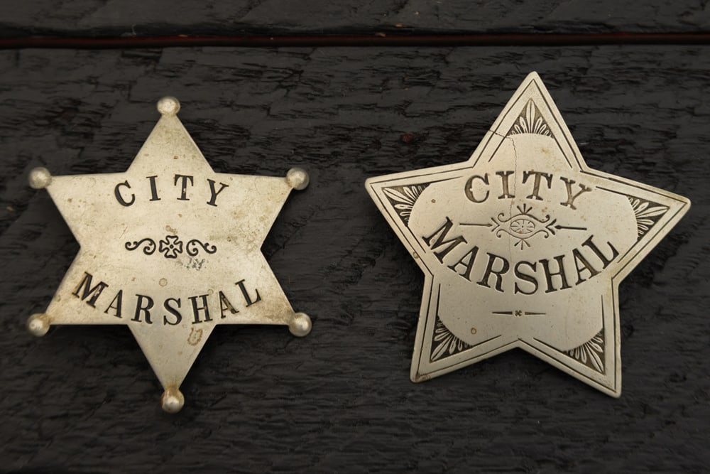 This lot consists of two Badges to include: (1) Vintage silver tone 6-point Ball Star Badge marked (1 of 2)