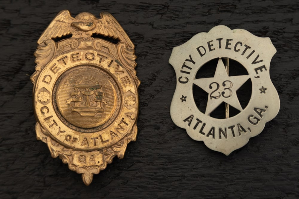 This lot consists of two Badges to include: (1) Vintage Shield Badge with Eagle Crest marked (1 of 2)