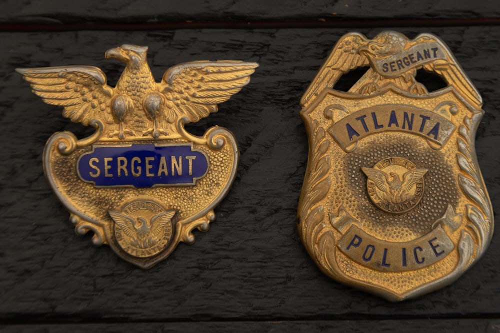 This lot consists of two Badges to include: (1) Large vintage Shield Badge with Eagle Crest marked (1 of 2)