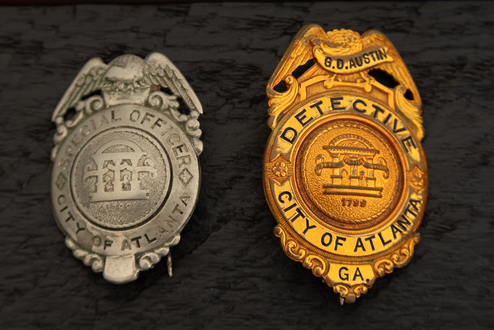 This lot consists of two Badges to include: (1) Vintage Shield Badge with Eagle Crest marked “ (1 of 2)