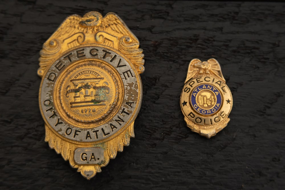 This lot consists of two Badges to include: (1) Vintage Shield Badge with Eagle Crest marked (1 of 2)