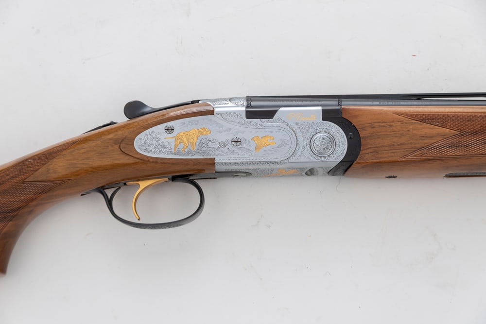 Beretta, 687 El Gold Pigeon II, 410 ga., O/U Shotgun, SN M28232B. New in box,, unfired with 26": Beretta, 687 El Gold Pigeon II, 410 ga., O/U Shotgun, SN M28232B. New in box,, unfired with 26" barrels, nickel finish receiver with scroll engraving, gold inlaid dogs, quail and duck. "P. Beretta" on