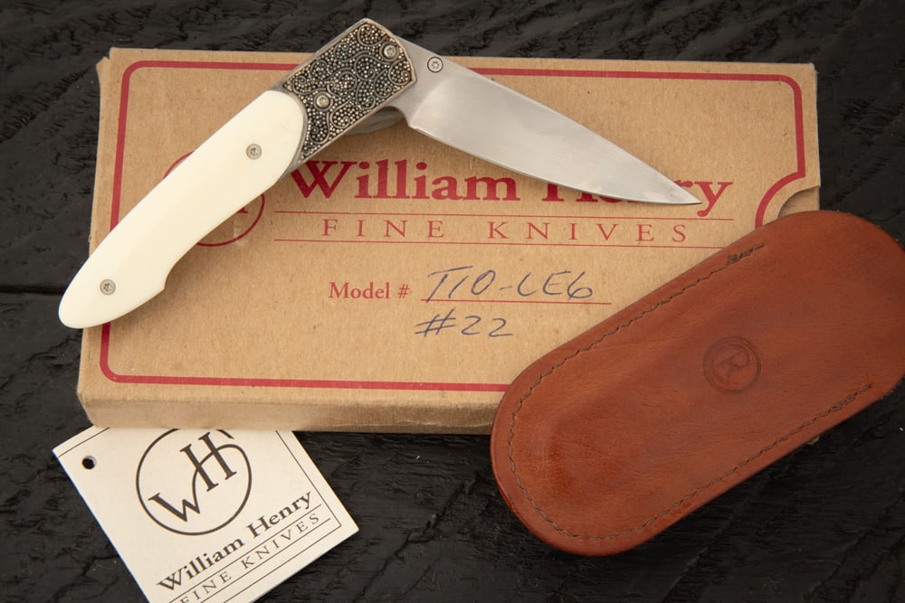A William Henry Custom Knife. Model TIO-LE6, #22, Bone Handle, Sterling, Opal Thumbstone. Sold in: A William Henry Custom Knife. Model TIO-LE6, #22, Bone Handle, Sterling, Opal Thumbstone. Sold in William Henry marked Box.
