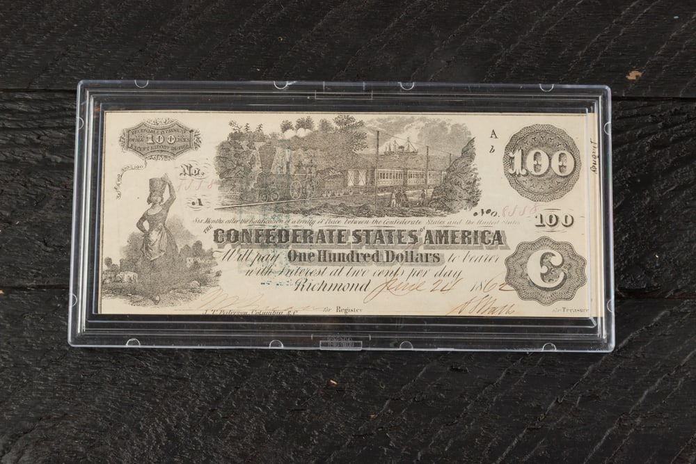 Scarce Confederate States of America One Hundred Dollar Train Note. This Note features a train and a (1 of 2)