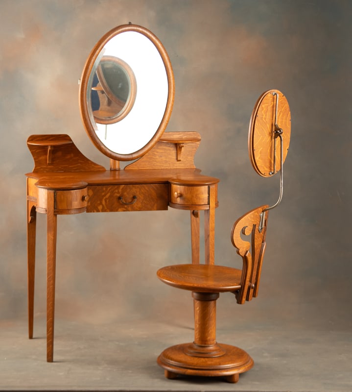 Rare antique, two piece quarter sawn oak Dressing Vanity and matching swivel Chair. Both Vanity and: Rare antique, two piece quarter sawn oak Dressing Vanity and matching swivel Chair. Both Vanity and Chair have matching adjustable oval beveled mirrors, very fine condition and finish, circa 1900. Thi