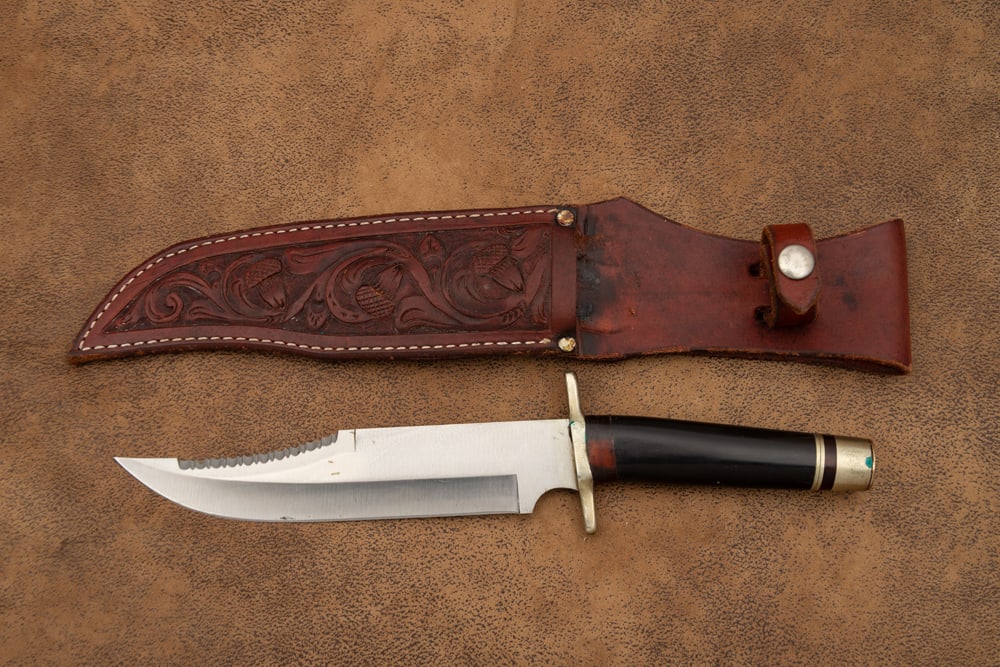 Handmade Clip Point Bowie Knife in leather sheath, appears have a horn handle with 8" blade, 13" (1 of 2)