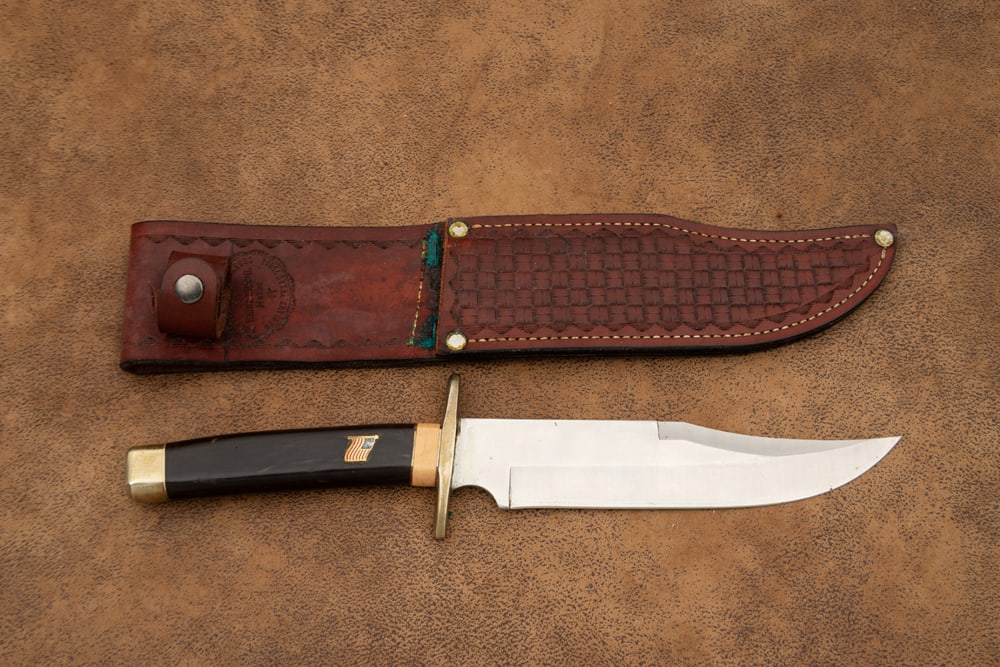 Handmade Clip Point Bowie Knife in leather sheath, appears to have a horn handle with inlaid (1 of 2)