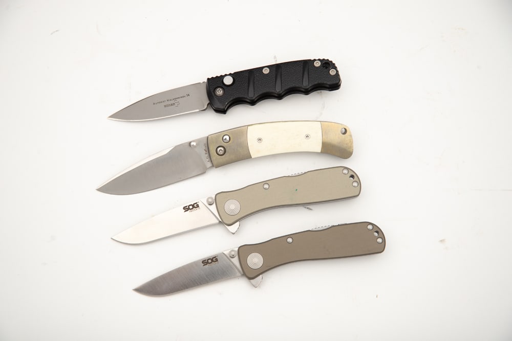 Four (4) Lock Blade Folding Knives. (1) "BOKER" marked Switch Blade with black handles, SN 17212, (1 of 1)
