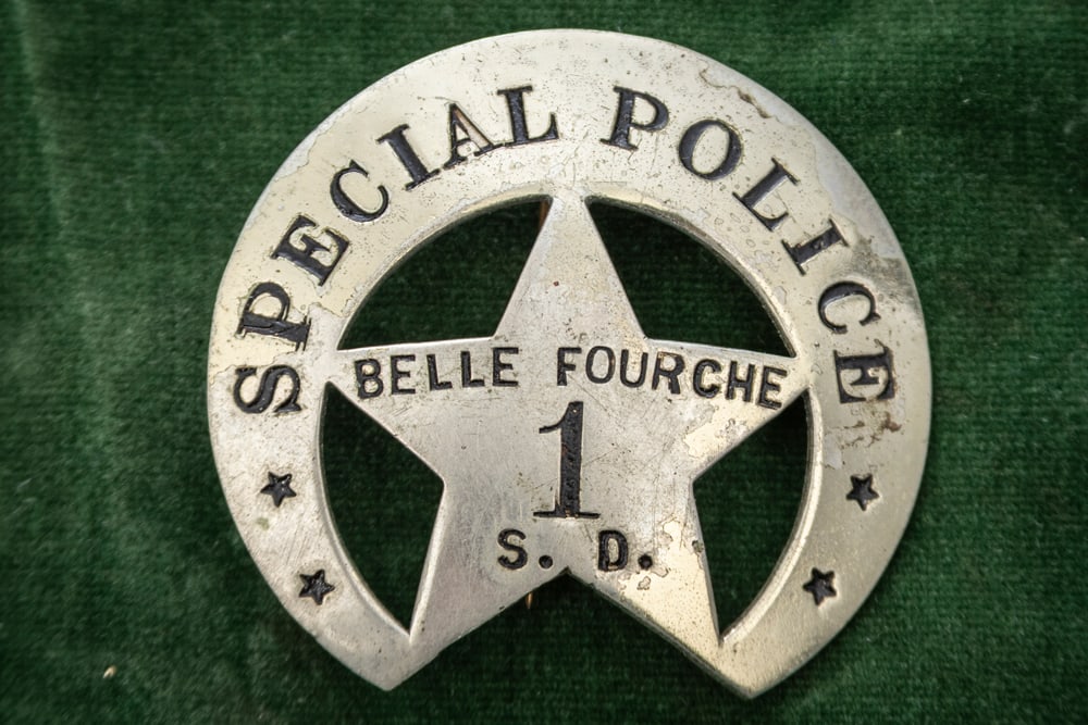 Vintage Crescent with 5-point cut-out Star Badge marked “SPECIAL POLICE?? with “BELLE FOURCHE/: Vintage Crescent with 5-point cut-out Star Badge marked “SPECIAL POLICE” with “BELLE FOURCHE/ 1/ S.D.” (South Dakota) on Star, has some plating loss on the front. Back has no hallmark