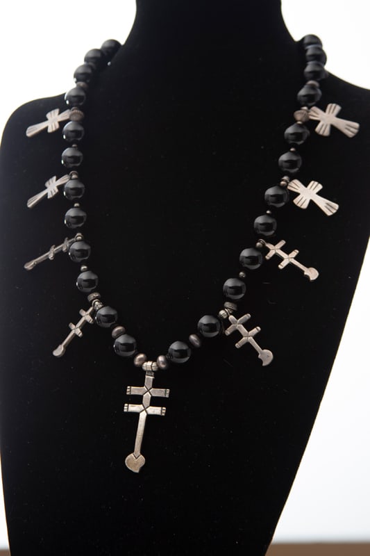 Southwest Style onyx beaded Necklace with 9 engraved crosses throughout, 24" long with silver beaded: Southwest Style onyx beaded Necklace with 9 engraved crosses throughout, 24" long with silver beaded spacers.