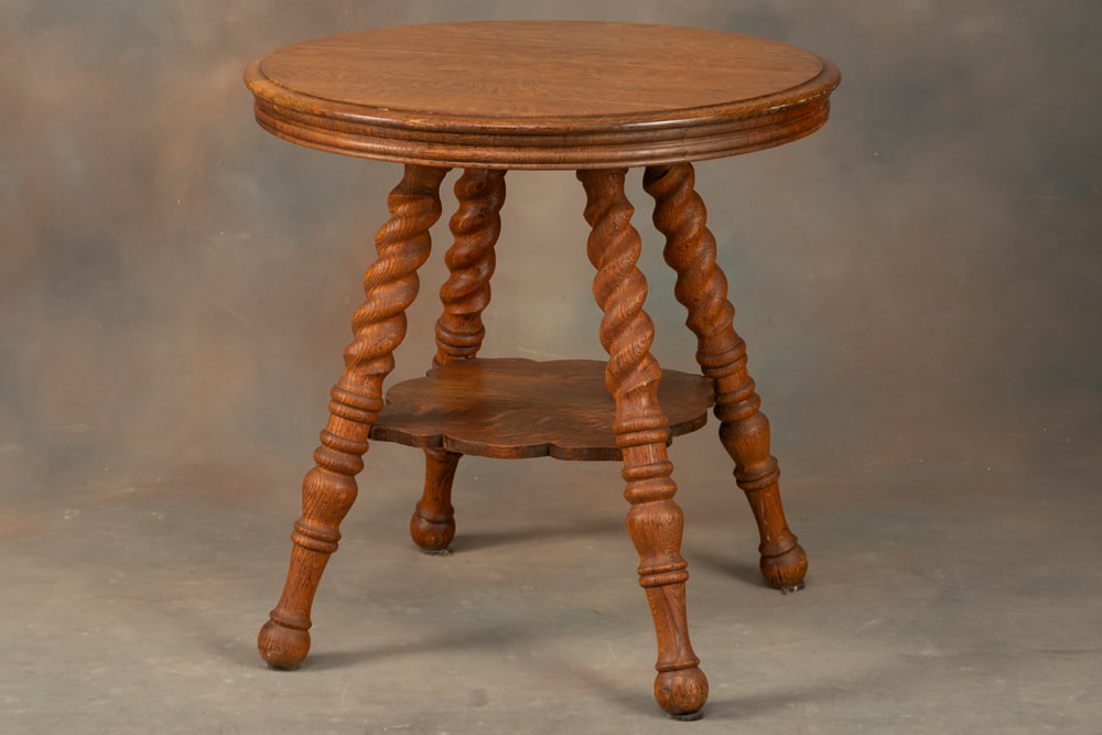 Fancy antique quarter sawn oak, round Lamp Table, circa 1900, with rope twist legs and suspended: Fancy antique quarter sawn oak, round Lamp Table, circa 1900, with rope twist legs and suspended stretcher, measures 28" T x 28" round shaped top. Good condition.