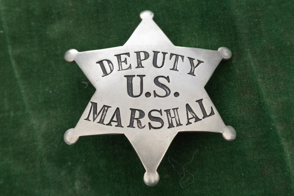 Silver colored vintage 6-point Ball Star Badge marked “DEPUTY / U.S. / MARSHAL??. Has spring pin (1 of 2)