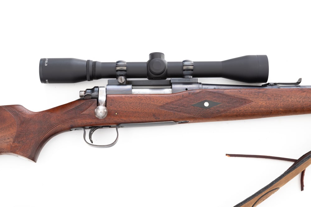 Remington, Model 722, B/A Rifle, .257 Roberts caliber, SN 131472, with 24" barrel, stock has been: Remington, Model 722, B/A Rifle, .257 Roberts caliber, SN 131472, with 24" barrel, stock has been customized with hand checkering and inlays. Fitted with sling and Burris 6 Power Scope. (MODERN)