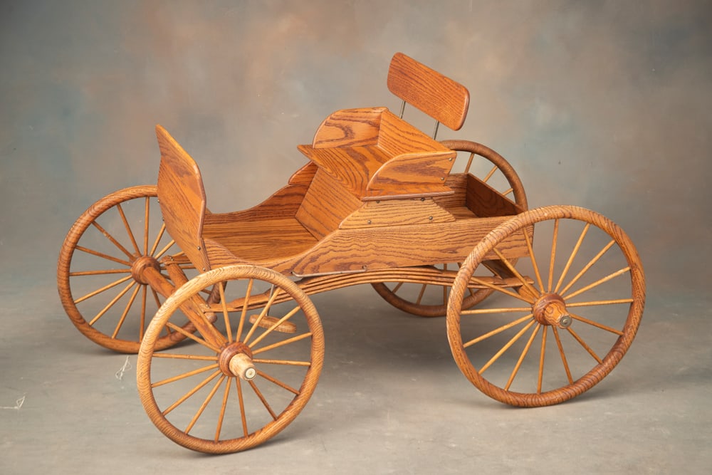 Amish handmade miniature oak Buggy, measures 44" L x 26" W, front wheels are 15" T, rear wheels are (1 of 2)