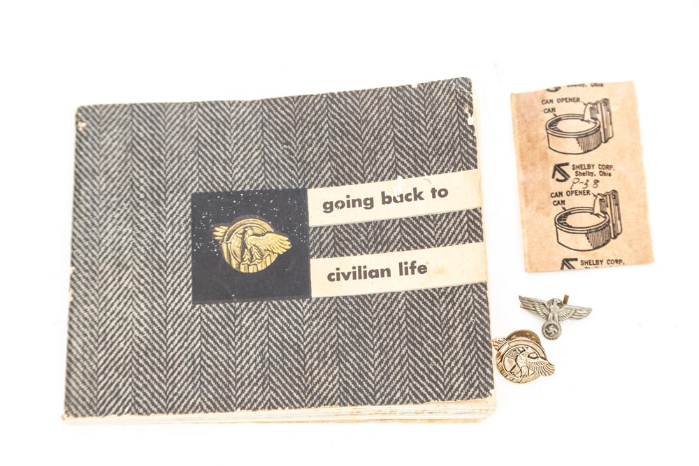 This lot consists of the following items: The WWII Brass Lapel Pin "Ruptured Duck" and matching: This lot consists of the following items: The WWII Brass Lapel Pin "Ruptured Duck" and matching Manual dated 1945. The Ruptured Duck is the nickname for the Honorable Service Lapel Button/Patch issued