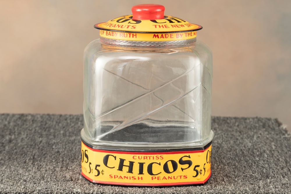 Very desirable Country Store Glass Peanut Jar with metal lid and metal Advertisement at base, (1 of 3)