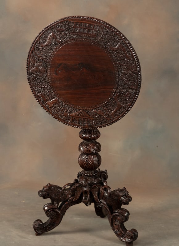 Highly carved Teakwood Tilt Top Table with carved base and lion heads, floral carved column (1 of 2)