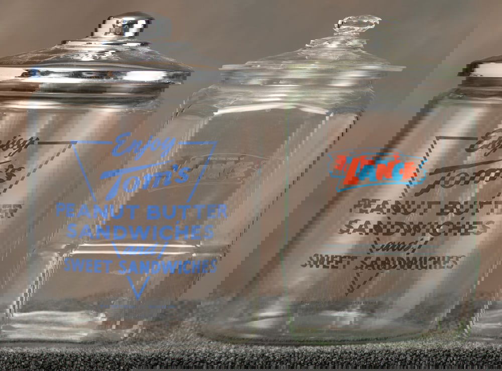 Two country store glass Advertising Jars. One is for "Toms Peanut Butter Sandwiches", with metal (1 of 1)