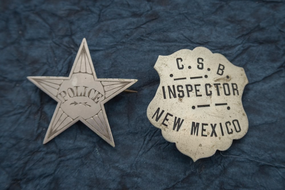 This lot consists of two Badges to include: (1) Vintage “C.S.B. INSPECTOR NEW MEXICO?? marked (1 of 2)