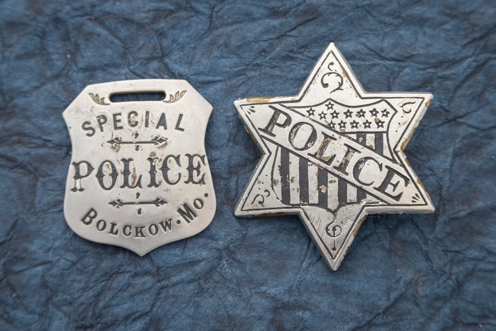 This lot consists of two Items: (1) Vintage 6-point Star Badge marked “POLICE?? across the: This lot consists of two Items: (1) Vintage 6-point Star Badge marked “POLICE” across the rendering of a Federal Shield with some small detailing on the tips of Star, missing some of the black