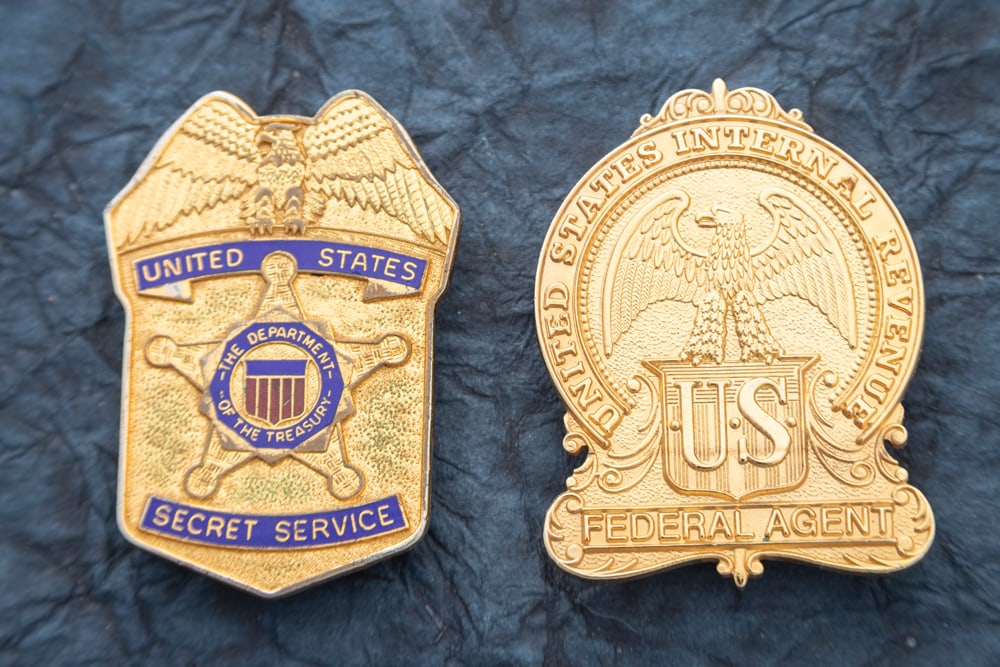 This lot consists of two Badges to include: (1) Vintage Eagle Crest Shield Badge marked “UNITED: This lot consists of two Badges to include: (1) Vintage Eagle Crest Shield Badge marked “UNITED STATES SECRET SERVICE” with “THE DEPARTMENT OF THE TREASURY” marked on raised Star cente