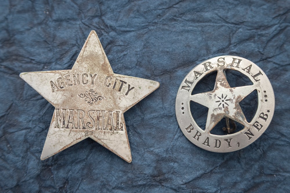 This lot consists of two Badges to include: (1) Vintage 5-point Star Badge marked "AGENCY / CITY / (1 of 2)