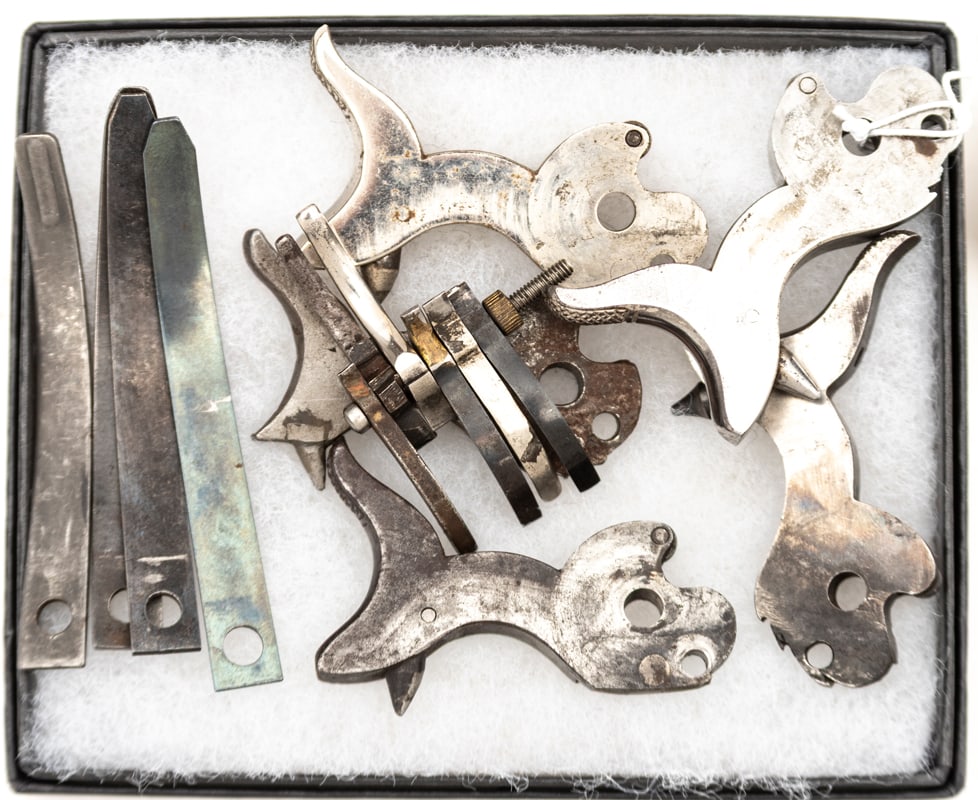 Group of Colt SA Revolver parts that include: Five Hammers, six Triggers, and four Hammer Springs. (1 of 1)