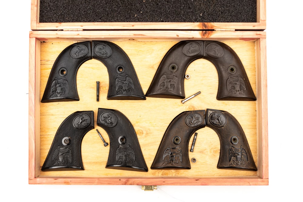 Collection of four sets of early 2-piece hard rubber Grips for Colt SAA Revolvers with raised (1 of 1)
