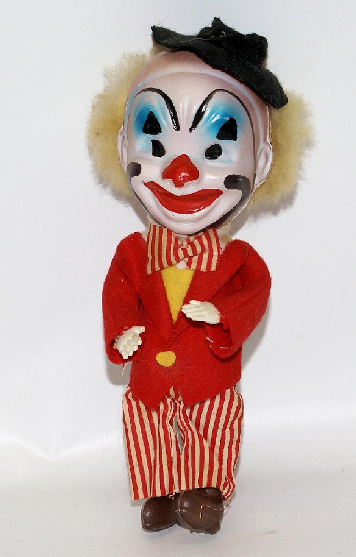8-1/2" CLOWN DOLL with Celluloid Head - Marked 'Made in: Vintage 8-1/2" CLOWN DOLL with Celluloid Head. Still has the 'Made in Japan' sticker on the back, and is also marked 'Japan' on the back of the head, underneath the hair. An interesting clown figure. 