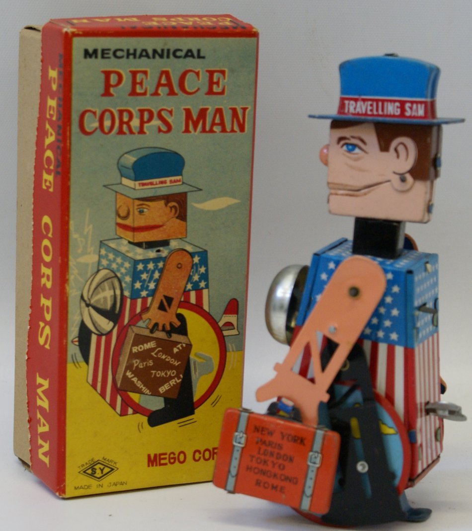 RARE Tin Mechanical Travelling SAM the PEACE CORPS MAN,: VERY RARE Tin Mechanical Travelling SAM the PEACE CORPS MAN by SY Japan, Mego Corp. Mint condition in the original box. Windup works perfectly. Measures 7" tall.
