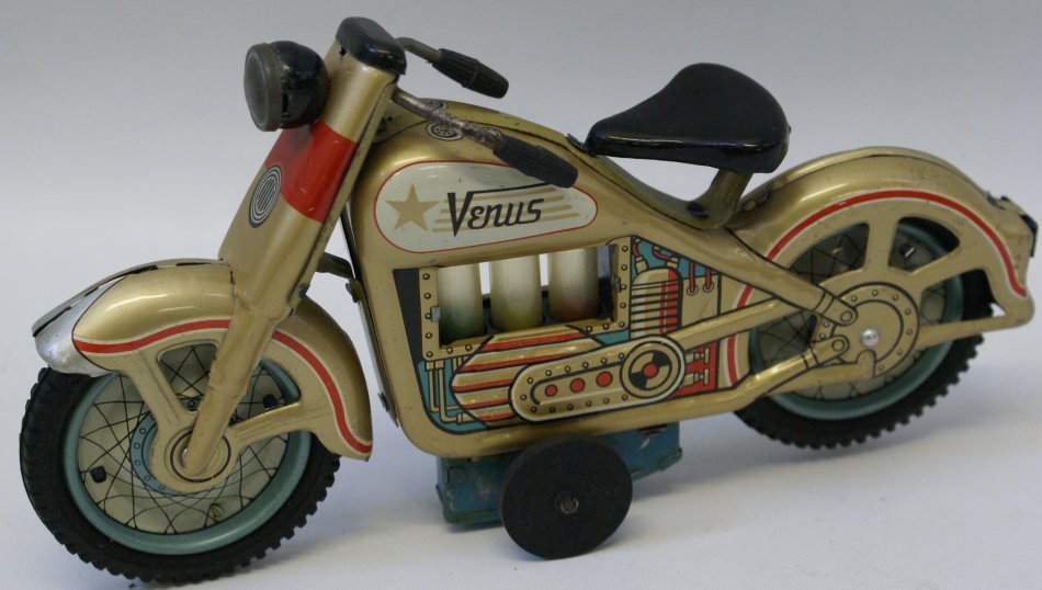 1960's Japan TN Venus Tin Plate Litho Friction: 1960's Japan TN Venus Tin Plate Litho Friction Motorcycle. The colored cylinders go up and down. Like new condition. Measures 9" long.