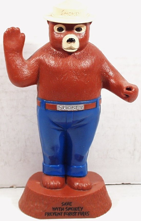 Smokey The Bear Savings Bank, hard plastic (bb10): Smokey The Bear Savings Bank, hard plastic, excellent condition with original trap, missing sign in his paw, 8 in. tall