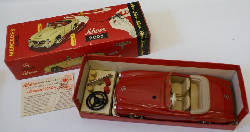 RARE 1950s Tin Schuco 2095 Mercedes 190SL in original: RARE 1950s Tin Plate Schuco 2095 Mercedes 190SL in original box with instructions, key, clockwork guidance steering column, and 5 pegs pylons (3 yellow & 2 red). Car measures 8-1/2" long. Perfect work
