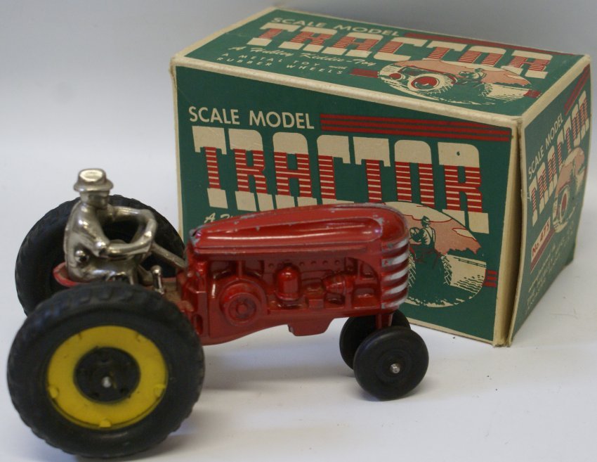 Hubley Kiddie-Toy Scale Model Tractor in Original Box.: Vintage Hubley Kiddie-Toy Scale Model Tractor in Original Box. Metal body and driver with rubber wheels. Excellent condition. A little playwear. 1 side box flap is missing. Tractor measures 7" long.
