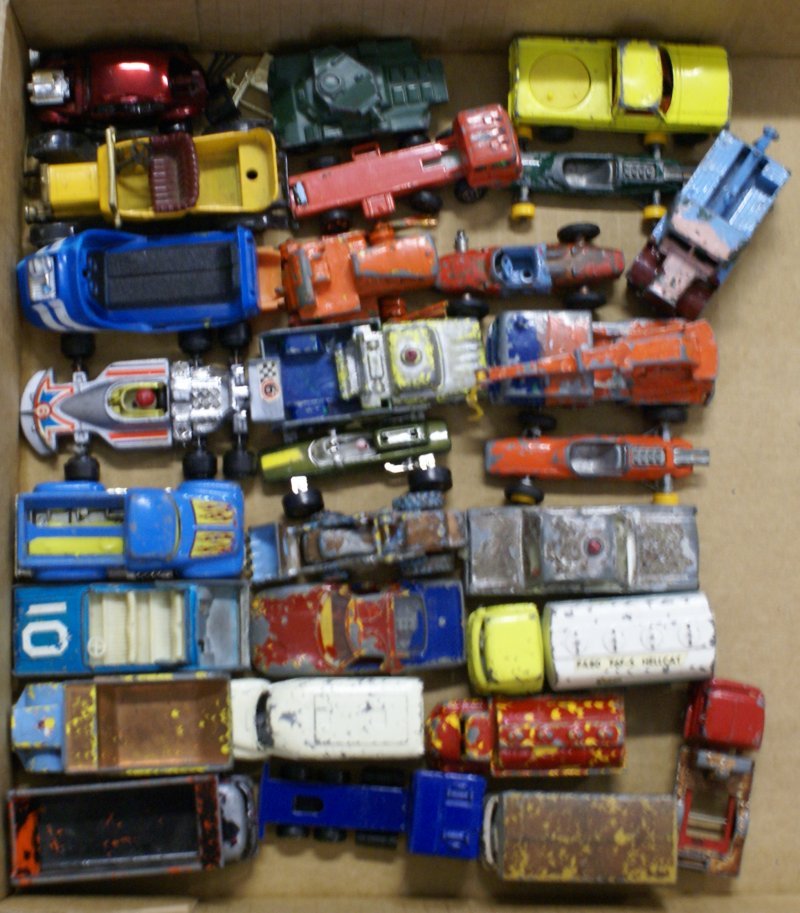 Large Lot of 28 1:64 Vintage Diecast Cars and Trucks -: Large Lot of 28 1:64 Vintage Diecast Cars and Trucks including Hot Wheels, early Matchbox Lesney, Budge, etc. All are in fair-good condition. Might be good for parts or restoration. Lot sold "as is."