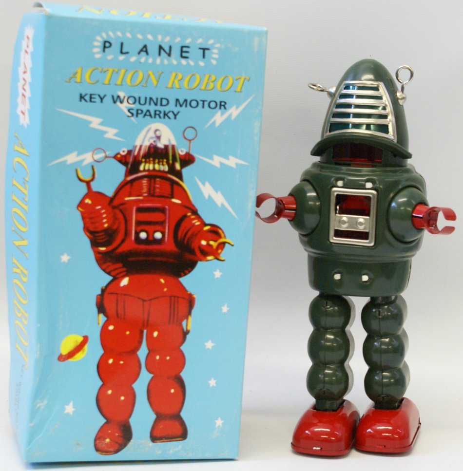 Tin Green PLANET ACTION Windup Sparking Robot, mint in: Green Tin Lithographed PLANET ACTION Wind up Robot Space Toy with key, sparky sparking action. 9" tall. Mint in the original box with inserts. This is based on the Robbie Robot from Forbidden Planet.