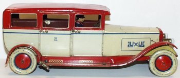 RARE Wind-up Lehmann EPL 785 Luxus Limo Limousine Car,: Windup #785 Lehmann Luxus Limo with battery operated headlights. Original bulbs. Measures 13" long. Excellent-LN condition. Ivory with red roof, wings, and running boards. Lithographed drivers. Clockw