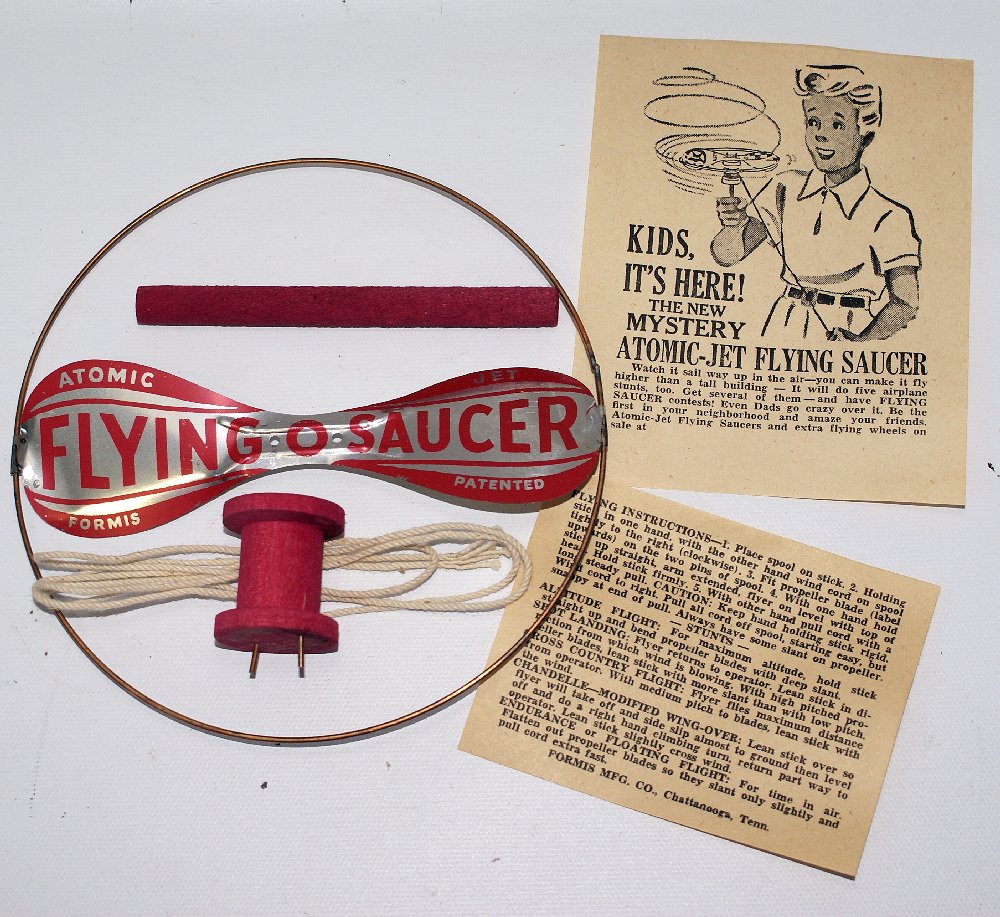 Vintage 1950's ATOMIC JET FLYING SAUCER Helicopter Gyro: Vintage 1950's ATOMIC JET FLYING SAUCER Helicopter Gyro Toy by Formis Manufacturing. Original old store stock. Absolutely mint condition! Comes complete with tin saucer, pink wood handle and spool, an
