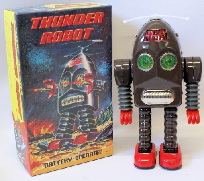 Vintage 1980'sTin Lithographed Battery Operated: Vintage 1980's Tin Lithographed Battery Operated THUNDER ROBOT ME 200 Space Toy in original box. Non-working condition. A nice shelf sitter. Perfect Christmas idea for the robot space toy lover! Measu