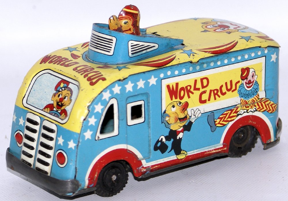 RARE Vintage 1950's WORLD CIRCUS Tin Lithographed: RARE Vintage 1950's WORLD CIRCUS Tin Lithographed Friction Bus Truck with Pop-up Monkey on Roof. Truck measures 4-3/4" long. Excellent condition. Some minor surface scratching, but a beautiful and ver