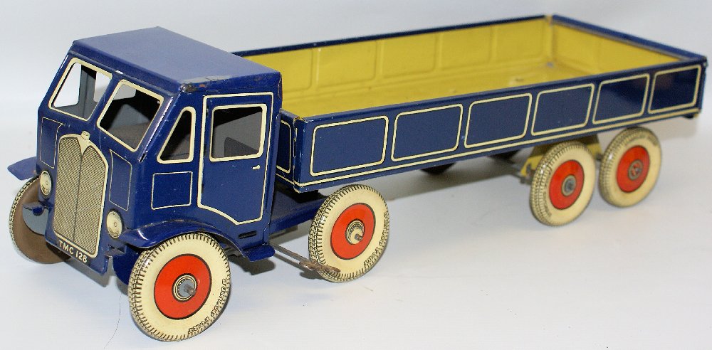 Vintage Tin Clockwork Large Articulated Lorry Truck: Vintage Tin Lithographed Clockwork Large Articulated Lorry Truck by Mettoy (UK). Blue body with white detail on both the cab and trailer. Impressive clockwork model. Tinplate Dunlop For-T balloon whee