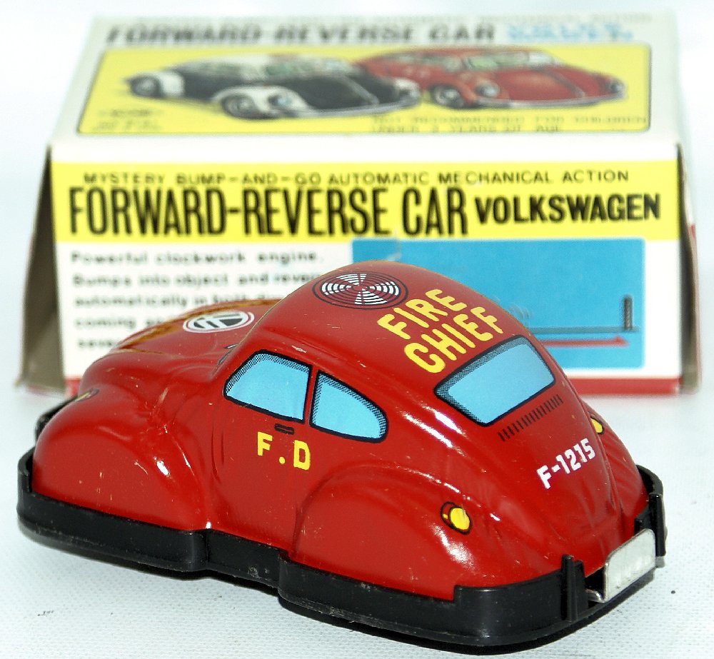 Vintage YONE Japan #2181 Tin Wind-up FIRE DEPT CHIEF: Vintage YONE Japan #2181 Tin Lithographed Wind-up FIRE DEPT CHIEF Volkswagen VW Toy Car. Clockwork mechanism works well. Has forward and reverse, with mystery bump-and-go automatic mechanical action.
