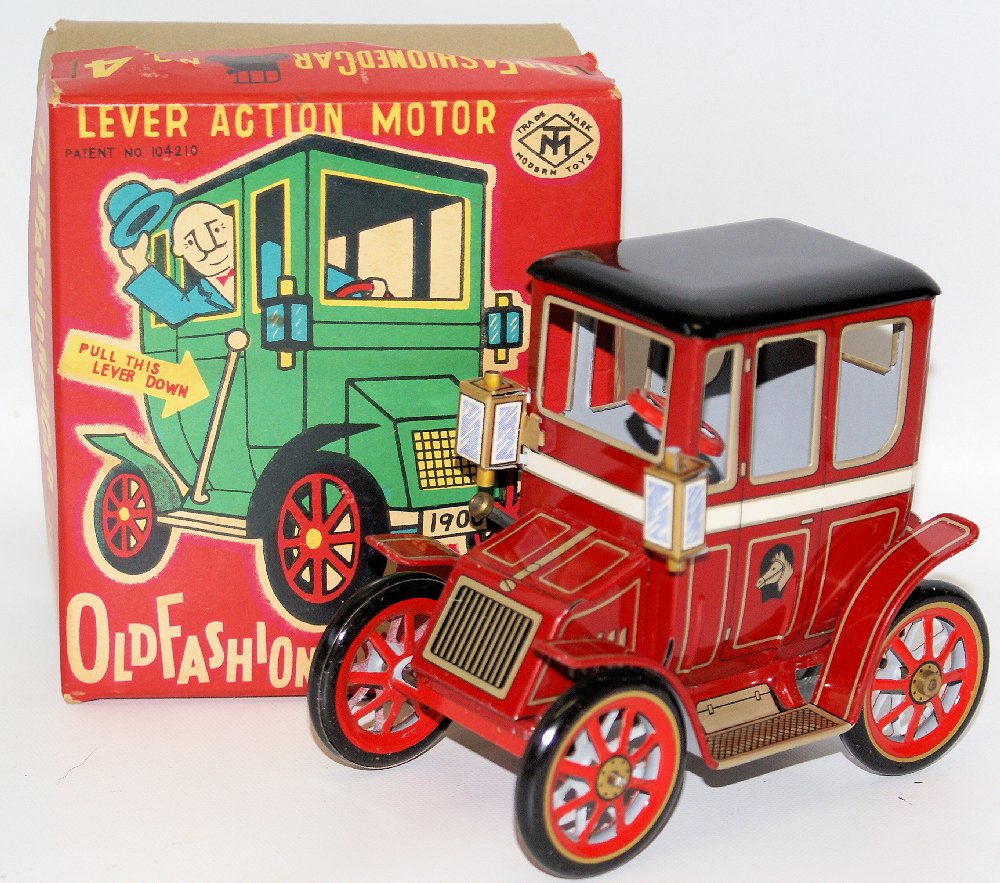 Vintage Tin Lever Action Old Fashioned Car #4, Modern: Vintage 1960's Tin Lithographed Lever Action Motor Old Fashioned Toy Car #4 by Modern Toys (MT), Japan.Absolutely beautiful lithography. Pull the lever back and car runs along. A few light surface lit